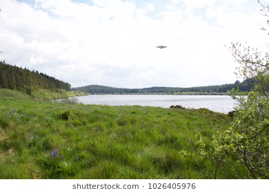 flying-saucer-ufo-over-lake-260nw-1026405976